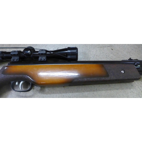 785 - A Weihrauch HW80 4.5 .177 calibre air rifle, with scope and silencer