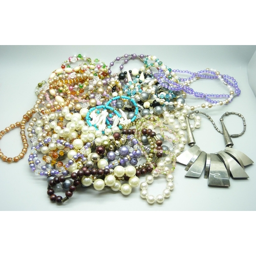 802 - A collection of thirty Czech and other retro bead necklaces, old shop stock