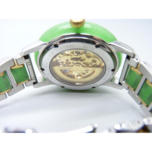 817 - An Eon wristwatch with jade bezel and jade inset to bracelet strap, skeleton movement, 44mm includin... 