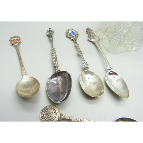 821 - A collection of silver spoons, three with British hallmarks, 34g and other continental examples in .... 