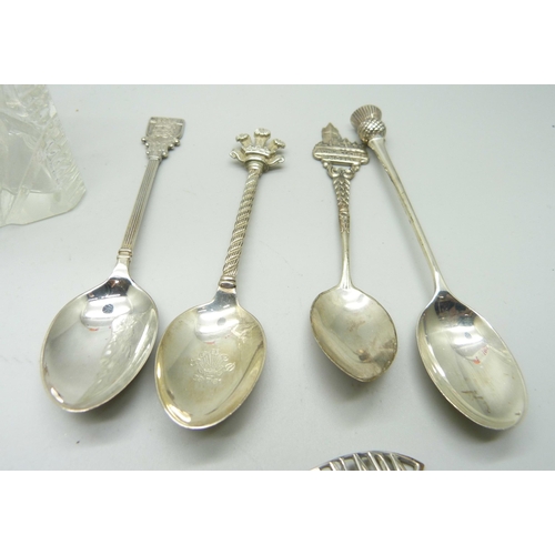 821 - A collection of silver spoons, three with British hallmarks, 34g and other continental examples in .... 