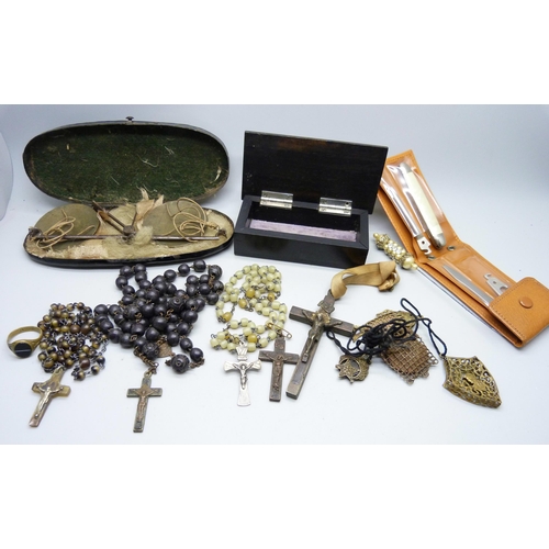 823 - A wooden box, a collection of rosary beads including one with .800 silver cross and other items