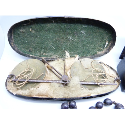 823 - A wooden box, a collection of rosary beads including one with .800 silver cross and other items