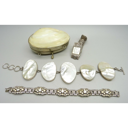 824 - A silver and mother of pearl bracelet, a silver and paste set bracelet, a lady's silver cocktail wat... 