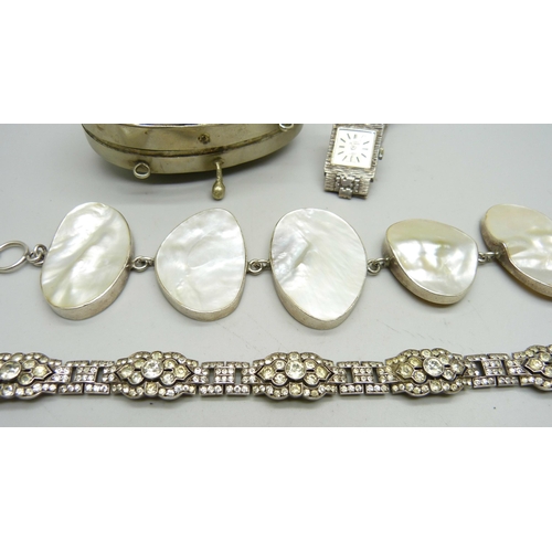 824 - A silver and mother of pearl bracelet, a silver and paste set bracelet, a lady's silver cocktail wat... 