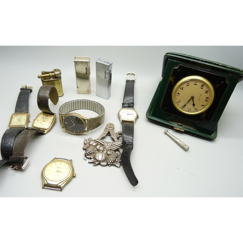 839 - An 8 day travel clock, wristwatches, lighters and a Masonic medal, inscribed 'Presented to the lodge... 