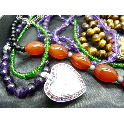 847 - A silver and tiger's eye bracelet, a silver watch on a silver mounted amethyst chain, three other si... 