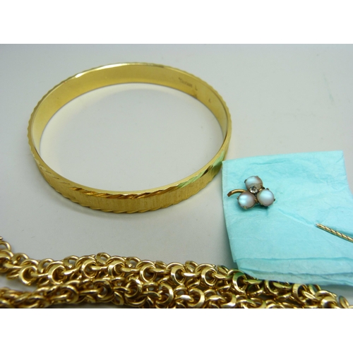 856 - Gold plated and gold tone jewellery including a Trifari bangle