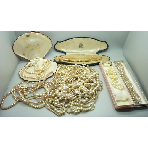 858 - A collection of faux pearls, some boxed