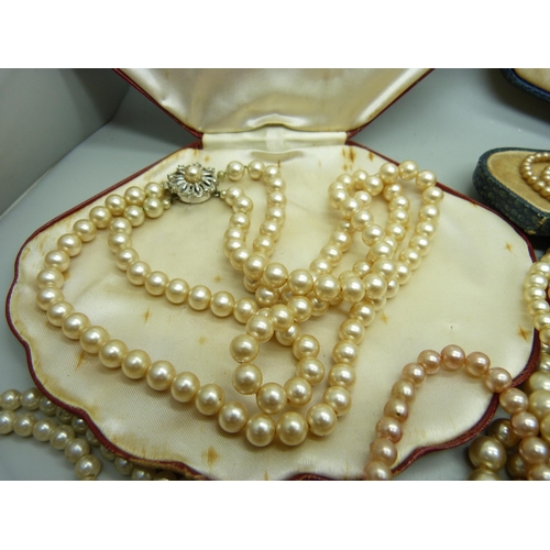 858 - A collection of faux pearls, some boxed