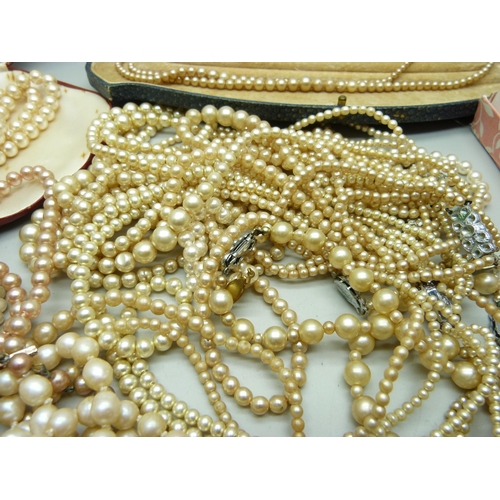 858 - A collection of faux pearls, some boxed