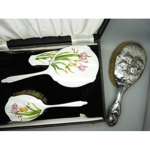 859 - A cased silver plated dressing table set with floral design, cased, together with a silver Reynolds ... 