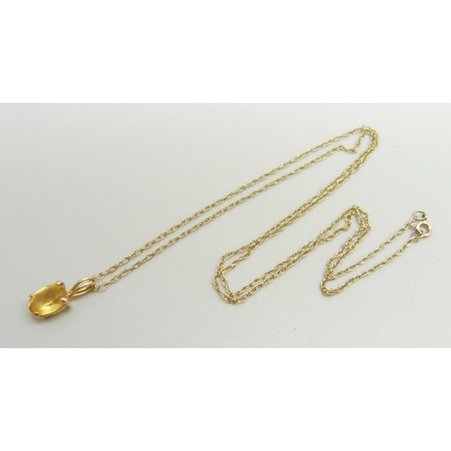 865 - A 14ct gold pendant set with a citrine on a fine 9k gold chain, chain approximately 47cm, pendant 1.... 