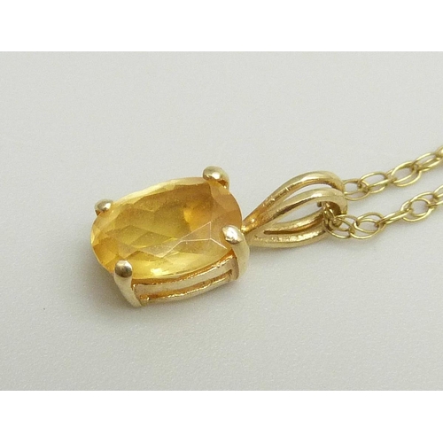 865 - A 14ct gold pendant set with a citrine on a fine 9k gold chain, chain approximately 47cm, pendant 1.... 