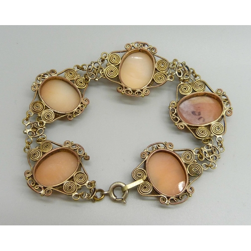 882 - A gilt metal filigree panel bracelet set with cameos, 20.5cm, cameos 1.8 x 1.3cm, 18g