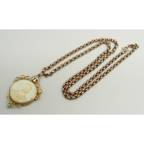 888 - A Victorian 9ct gold photograph pendant set with turquoise and seed pearls with 9ct plaque verso, at... 