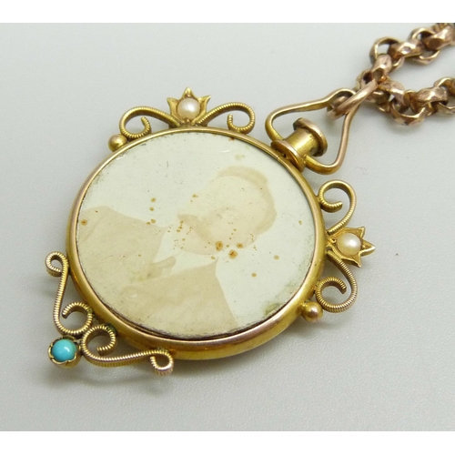 888 - A Victorian 9ct gold photograph pendant set with turquoise and seed pearls with 9ct plaque verso, at... 