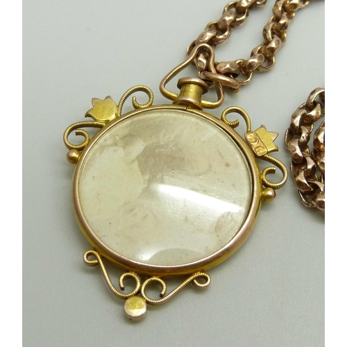 888 - A Victorian 9ct gold photograph pendant set with turquoise and seed pearls with 9ct plaque verso, at... 