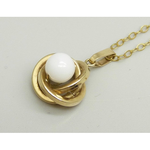 889 - A yellow metal and bead pendant on a fine 9ct gold chain, 44cm, 1.6g