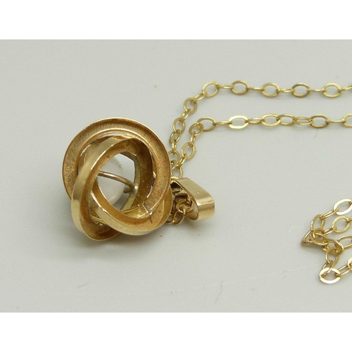 889 - A yellow metal and bead pendant on a fine 9ct gold chain, 44cm, 1.6g