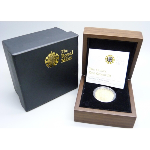 912 - The Royal Mint, a George III gold Guinea 1788, boxed with certificate