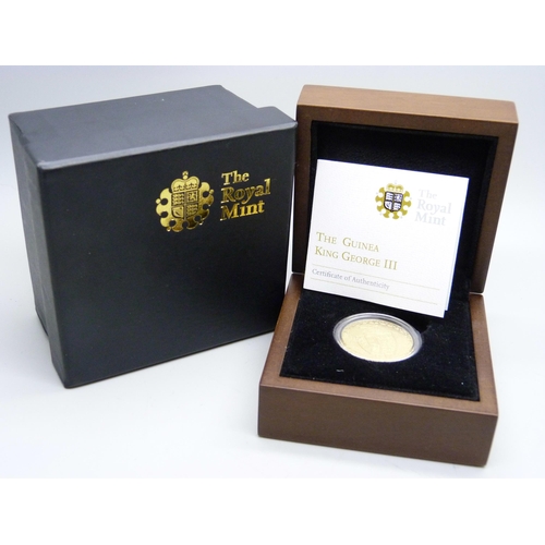 913 - The Royal Mint, a George III gold Guinea 1788, boxed with certificate