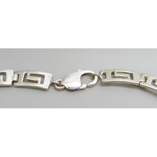 919 - A silver Greek key style cut-out design collarette, 44g