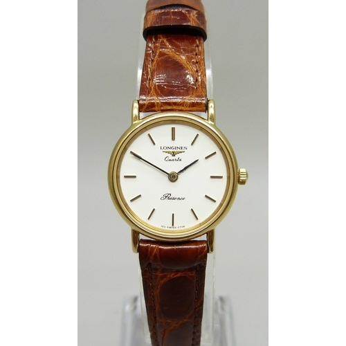 921 - A lady's Longines quartz wristwatch on a Cobra leather strap, 25mm including crown