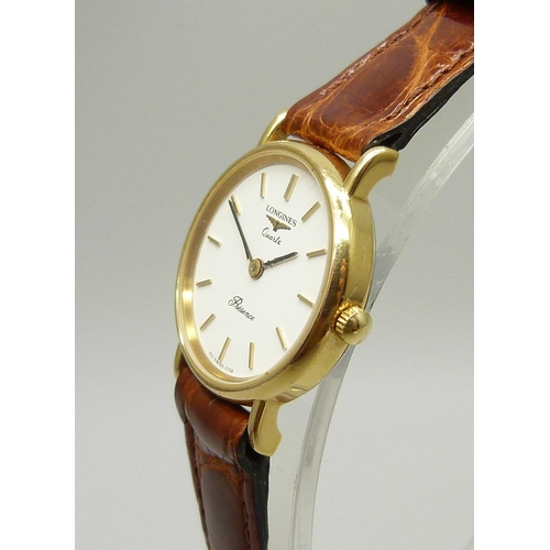 921 - A lady's Longines quartz wristwatch on a Cobra leather strap, 25mm including crown