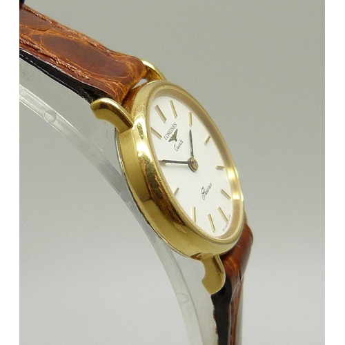 921 - A lady's Longines quartz wristwatch on a Cobra leather strap, 25mm including crown