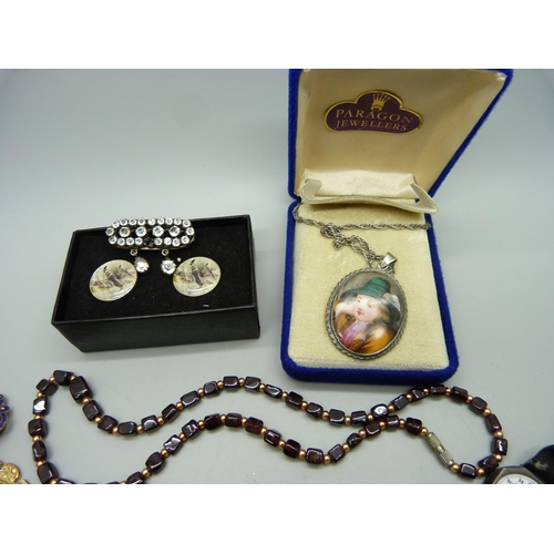 922 - A garnet necklace, a pair of silver cufflinks, a silver cased wristwatch, a silver fox bar brooch, e... 