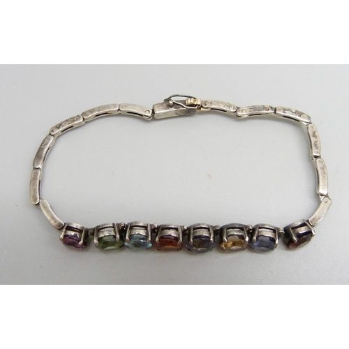 924 - A white metal bracelet set with eight multi-coloured stones, 8g, 16.5cm long