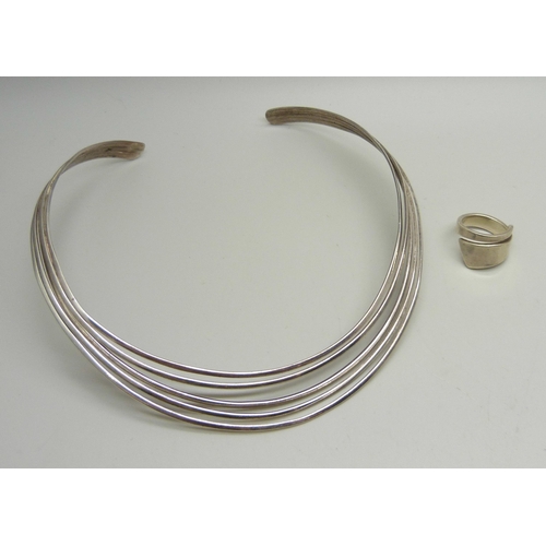 928 - A silver torque necklace and a silver ring, M/N, 47g total