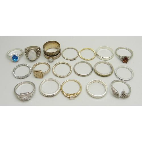 937 - Ten silver rings, 35g, together with eight other plated and white metal rings