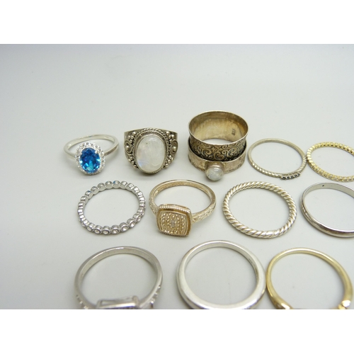 937 - Ten silver rings, 35g, together with eight other plated and white metal rings