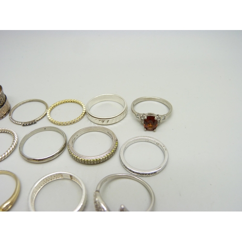 937 - Ten silver rings, 35g, together with eight other plated and white metal rings