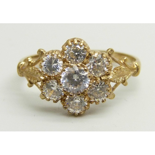 940 - A 9ct gold and white stone cluster ring, 2.2g, P