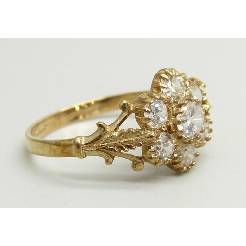 940 - A 9ct gold and white stone cluster ring, 2.2g, P