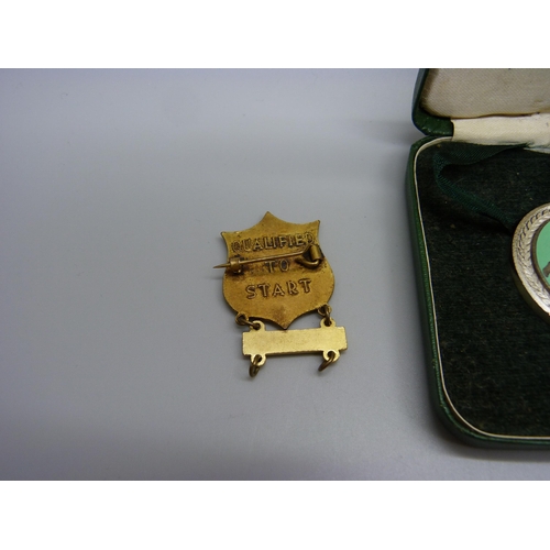 945 - A Manx Grand Prix medallion for completion of the course, cased, together with a badge for qualifica... 