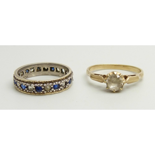 948 - A 9ct gold ring set with a white spinel, O, and a 9ct gold and silver eternity ring (a/f lacking sto... 