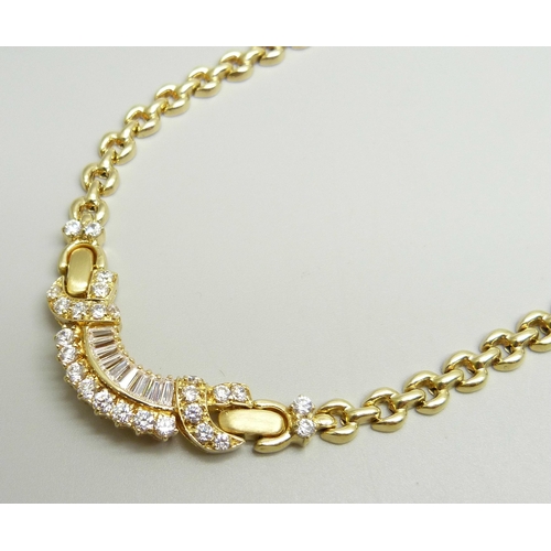 951 - A 14ct gold and white stone set necklace, (small split in one hollow link), 25.8g