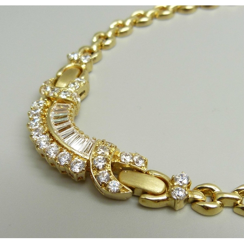 951 - A 14ct gold and white stone set necklace, (small split in one hollow link), 25.8g