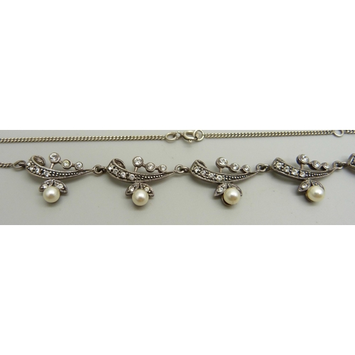 953 - A silver necklace set with white stones and faux pearls, 51cm, 16g