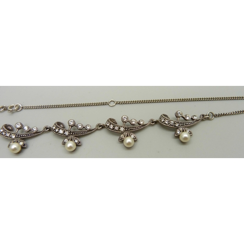 953 - A silver necklace set with white stones and faux pearls, 51cm, 16g