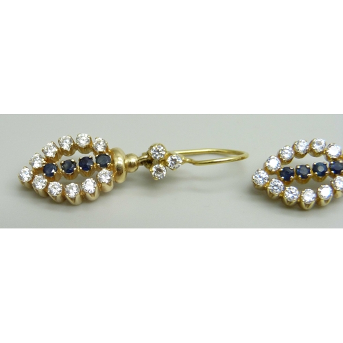 957 - A pair of yellow metal drop earrings set with white and dark blue stones, approximately 3.6cm drop i... 