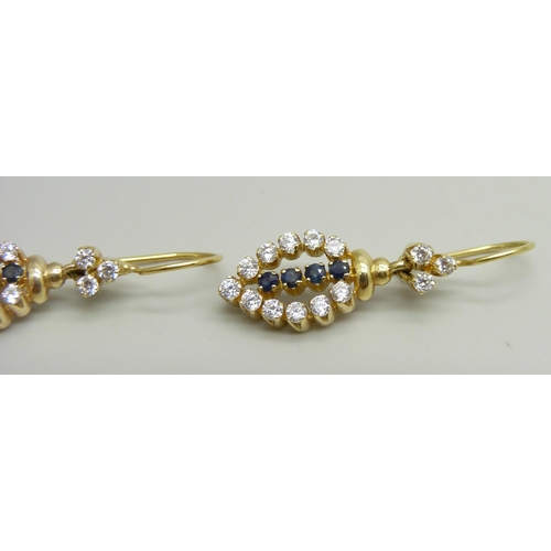 957 - A pair of yellow metal drop earrings set with white and dark blue stones, approximately 3.6cm drop i... 