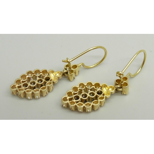 957 - A pair of yellow metal drop earrings set with white and dark blue stones, approximately 3.6cm drop i... 