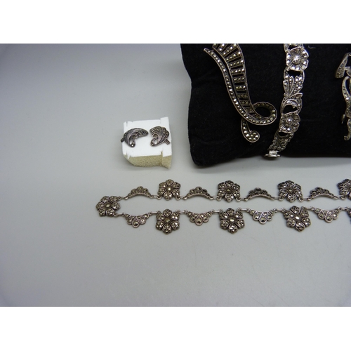 959 - A collection of silver and marcasite jewellery; a necklace (missing one stone), a .800 ring, two bro... 