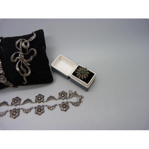 959 - A collection of silver and marcasite jewellery; a necklace (missing one stone), a .800 ring, two bro... 