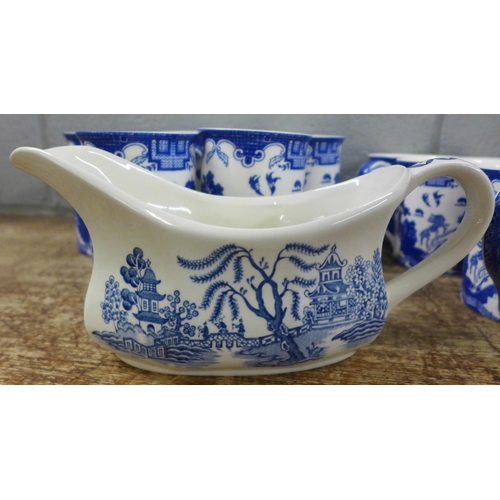 979 - Thirteen Leonardo Collection blue and white mugs, other blue and white vases, jugs, teapot, etc., Ri... 